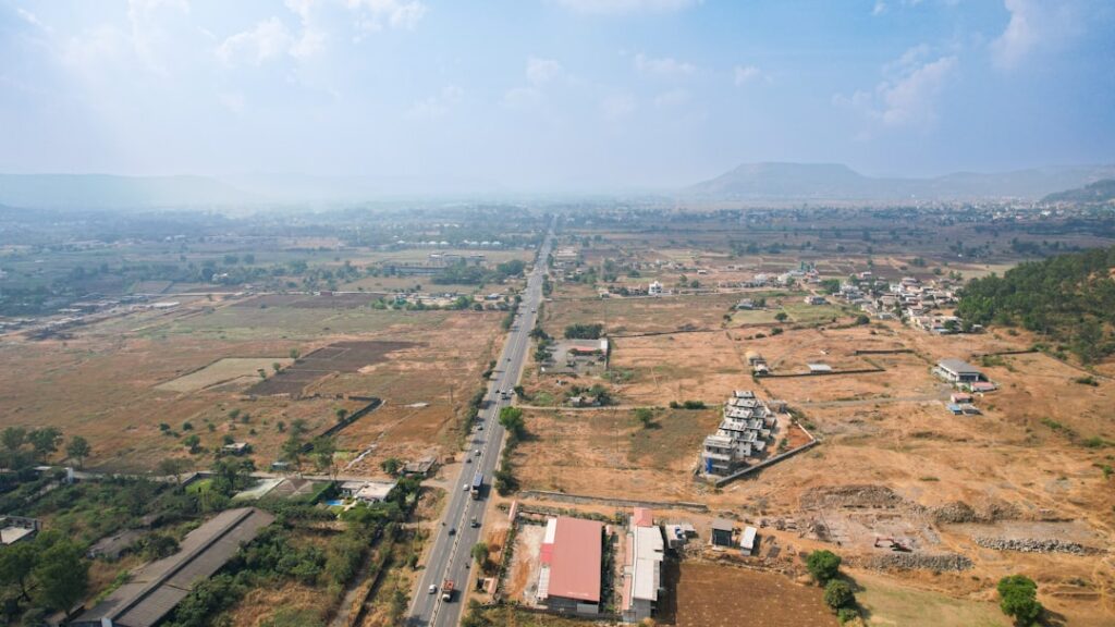Aerial view of Samruddhi Mahamarg Thane-Igatpuri stretch showing infrastructure impact on surrounding real estate